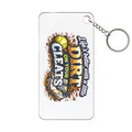 Keychain with 'Life's better on dirt with cleats' text and graphic design on a white background
